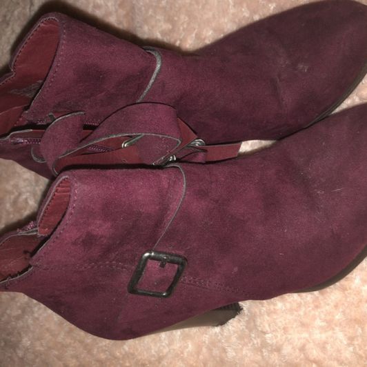 Worn burgundy boots
