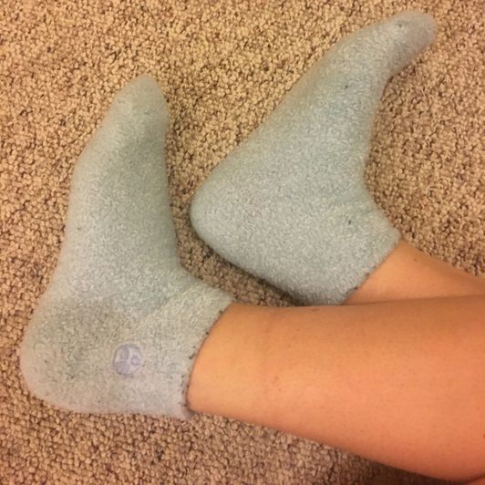 Worn smelly blue fuzzy socks