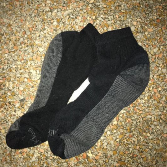 Worn out black and gray socks