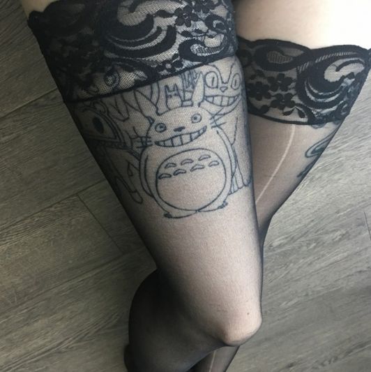 Worn thigh high stockings with some rips