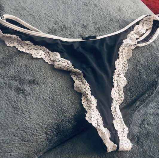 Black thong with white lace trim and Cum