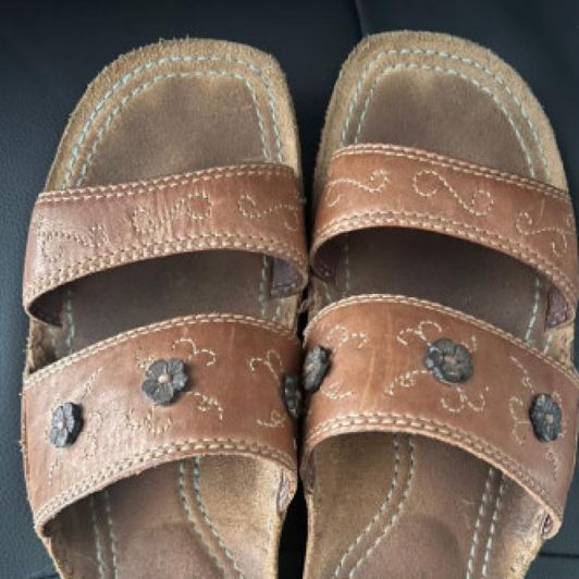 Worn sandals with toe print