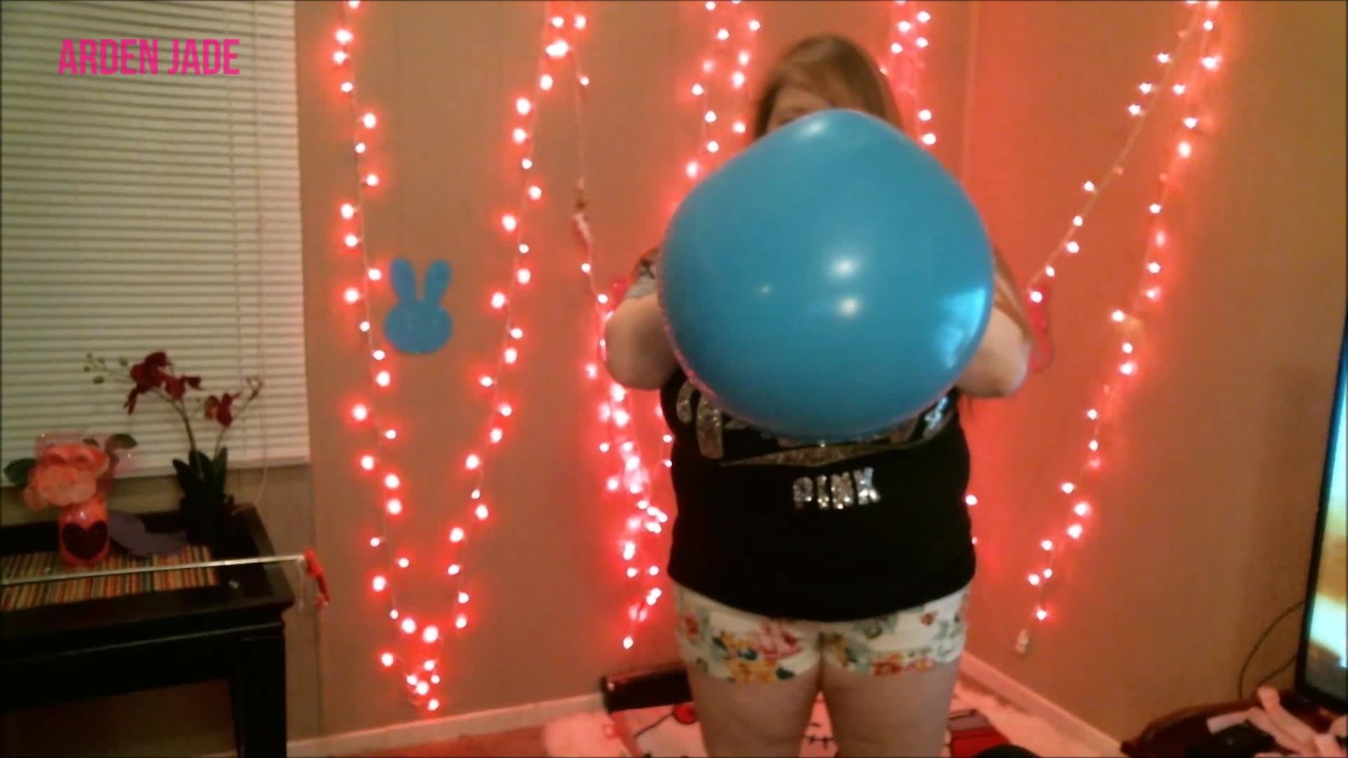 Blowing up a big blue balloon