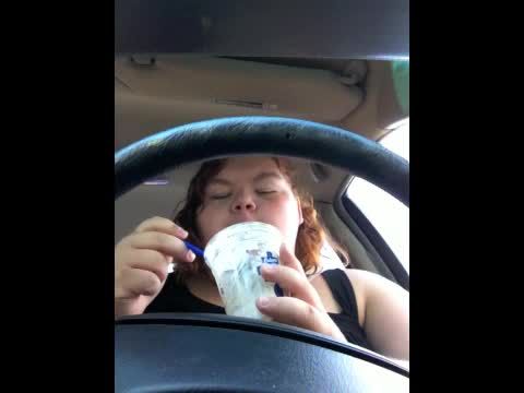 Fat piggy eating in car