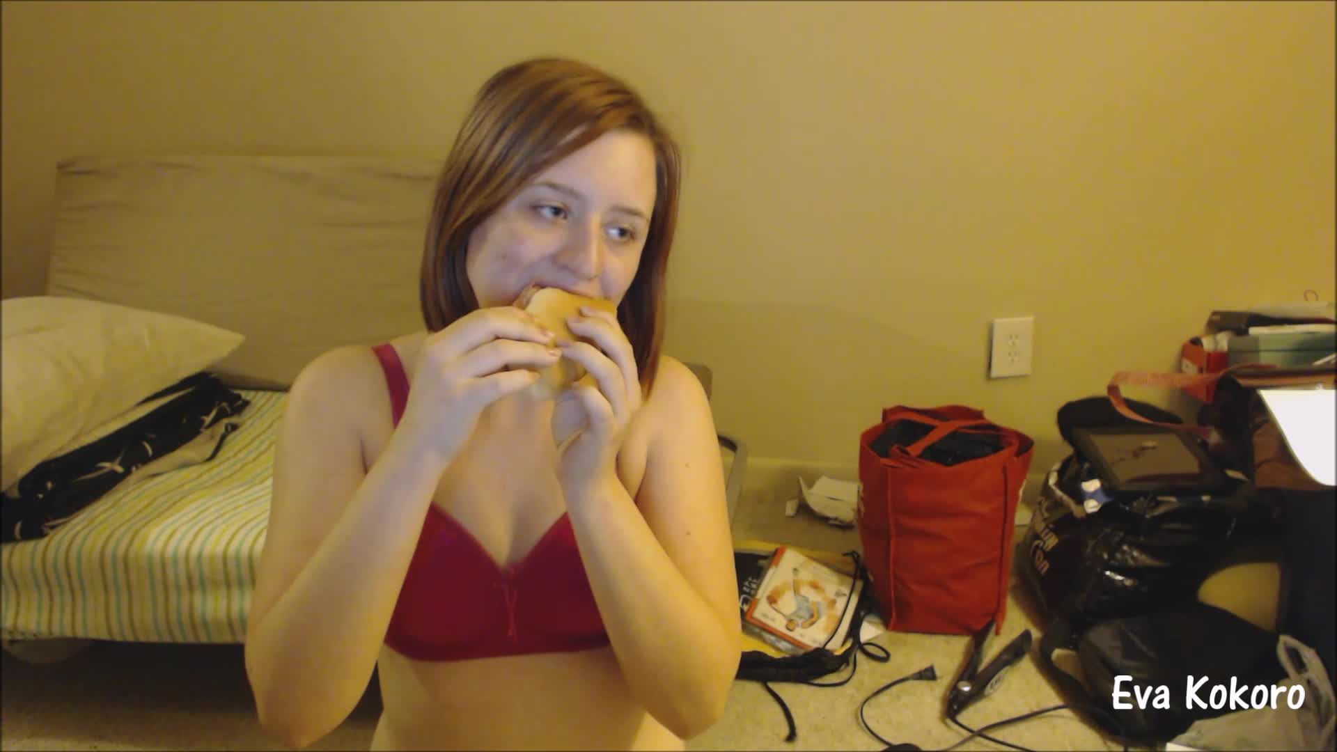 Hungry girl eating a huge sub