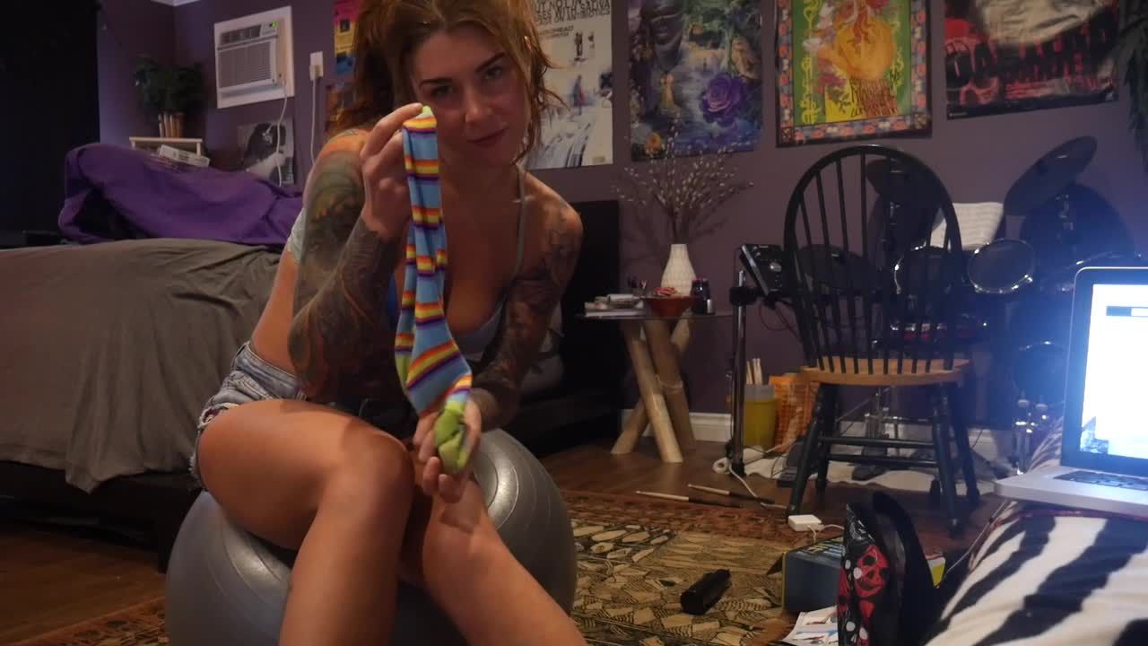 Felicity Feline plays with rainbow socks