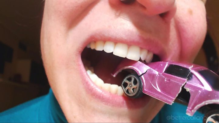 Chewing a toy car with my cruel teeth