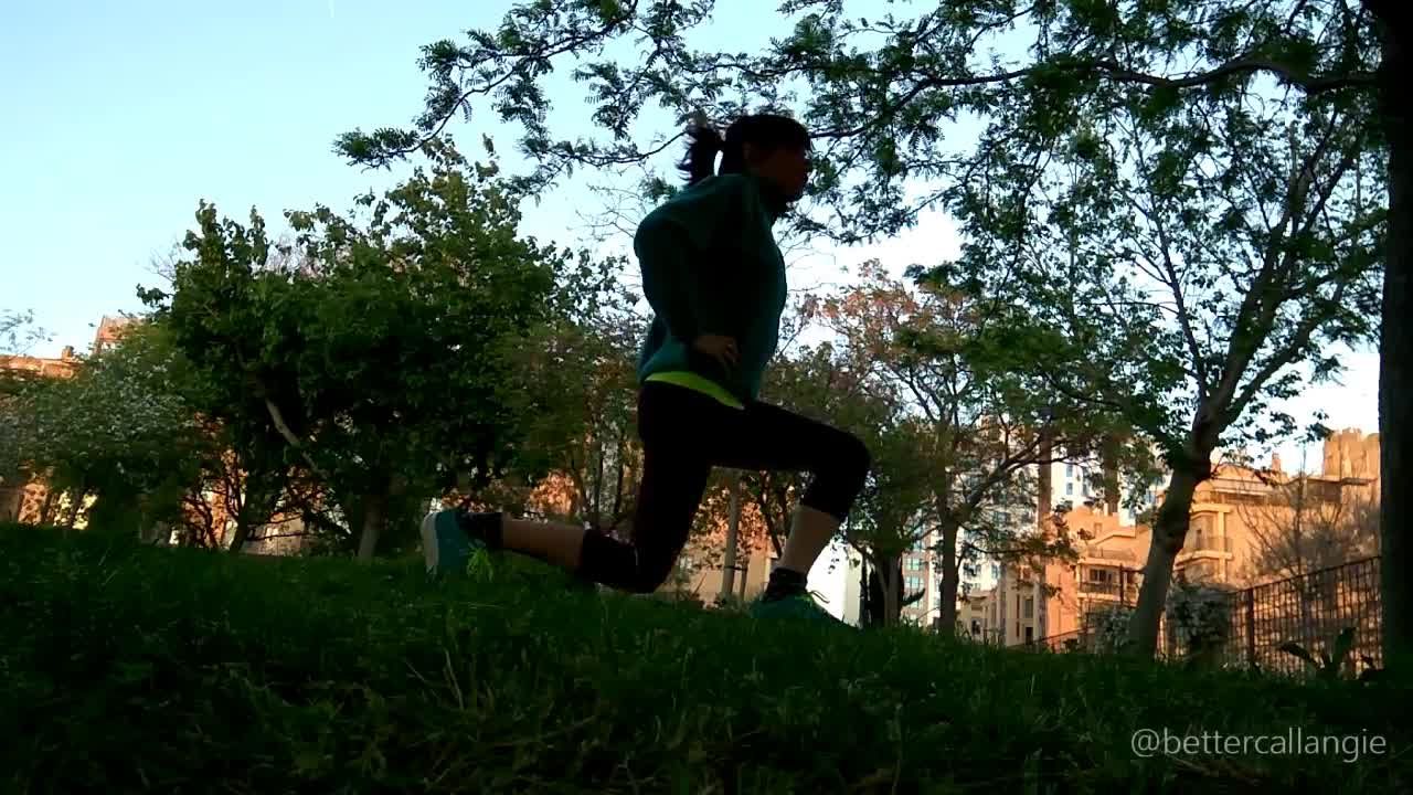 Doing lunges in a public park at sunset