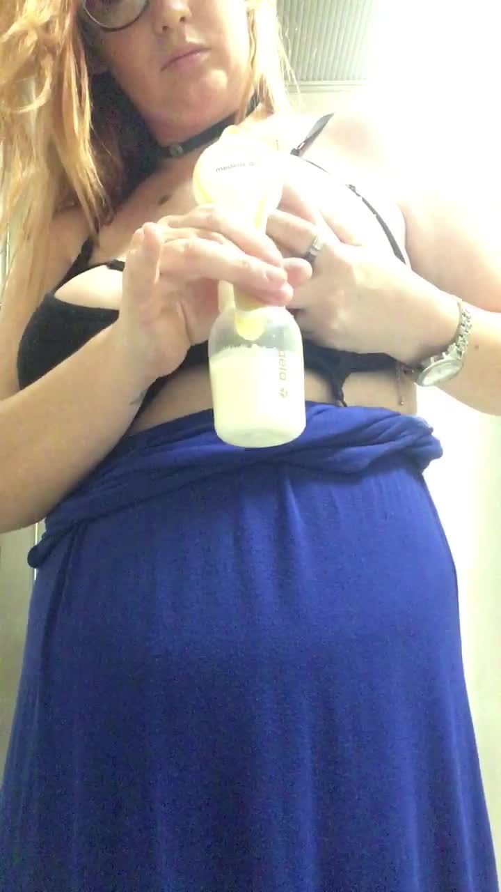 Pumping milky tits in public bathroom