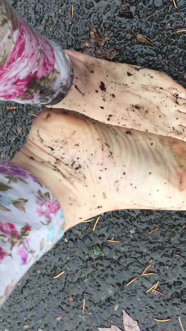 Dirty Feet Splashing in a Mud Puddle