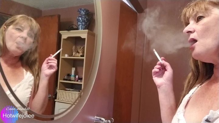 Smoking in front of my bathroom mirror