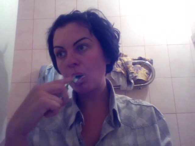 Kate brushing her teeth
