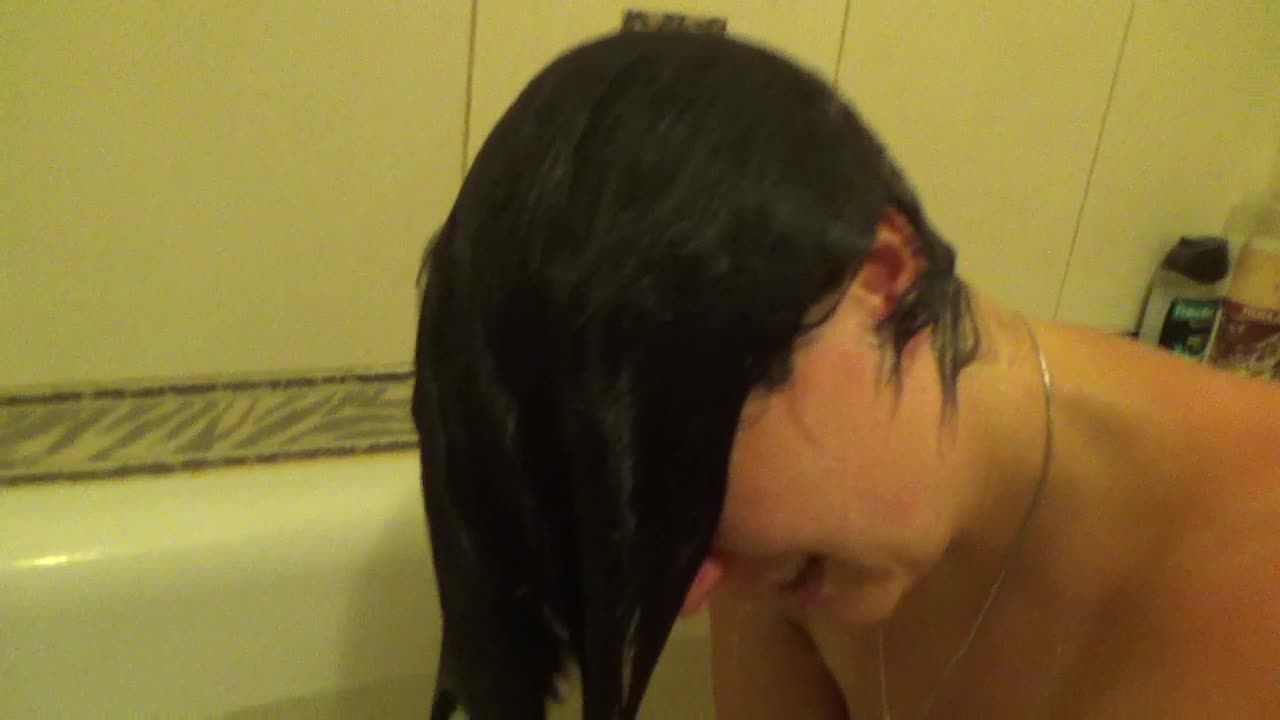 Kate diving in the bathtub , wet hair