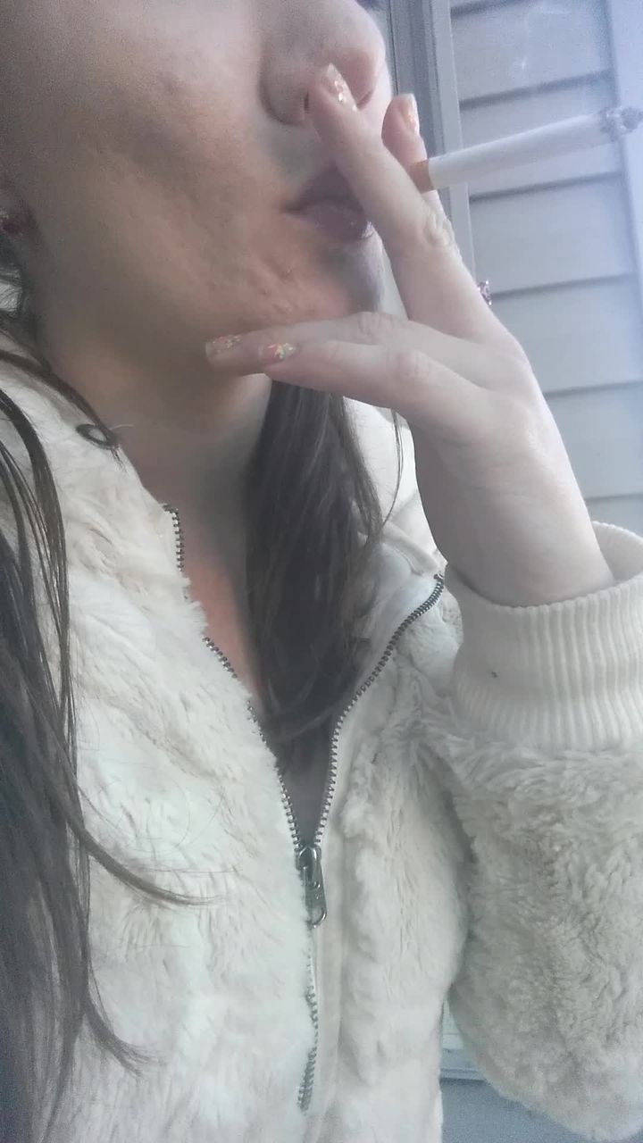Smoking Cig in Fur Coat and Pigtails