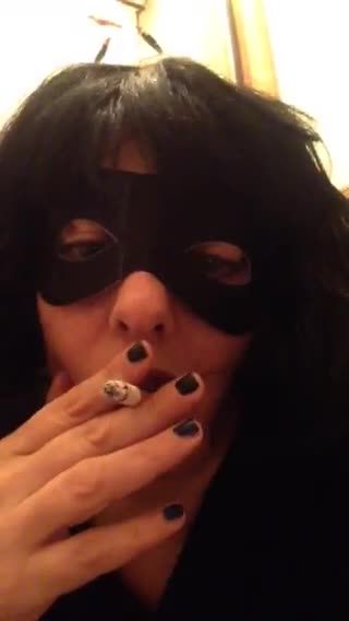 Masked babe enjoying her cigarette
