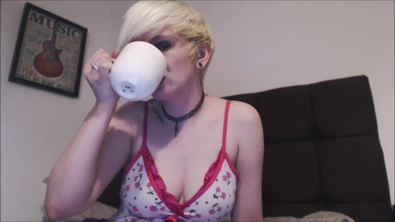 Pixie in PJs Yawning with Coffee
