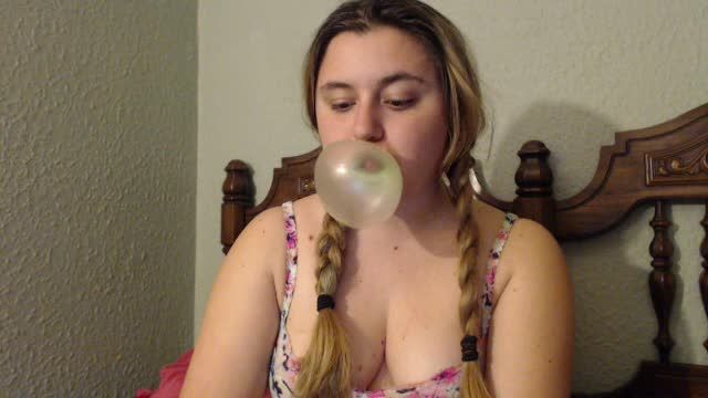 Blowing bubbles in pigtails