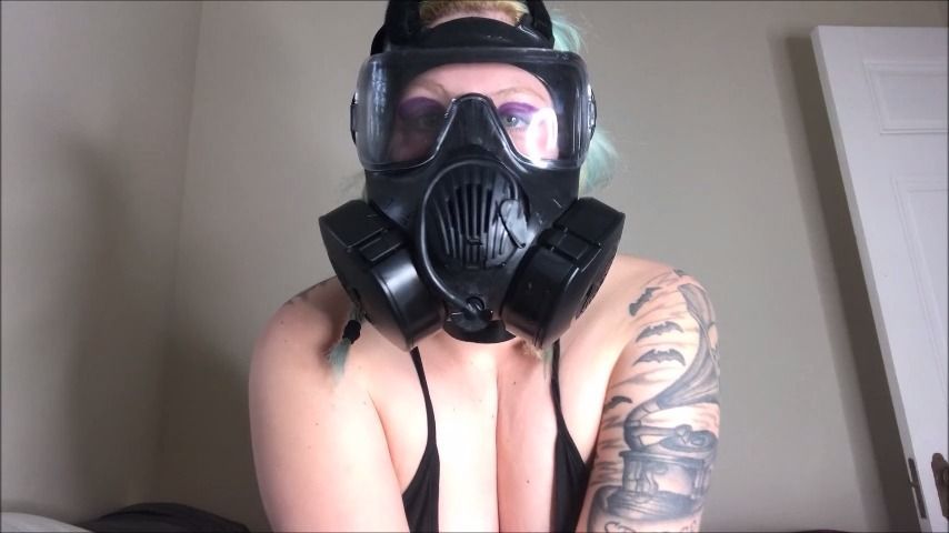 Quickie showing off gas mask
