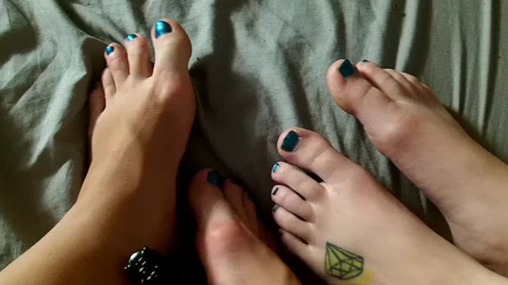 Two Girl Painting Their Toenails