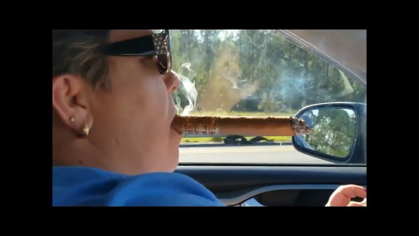 Driving And Smoking Big Cigars