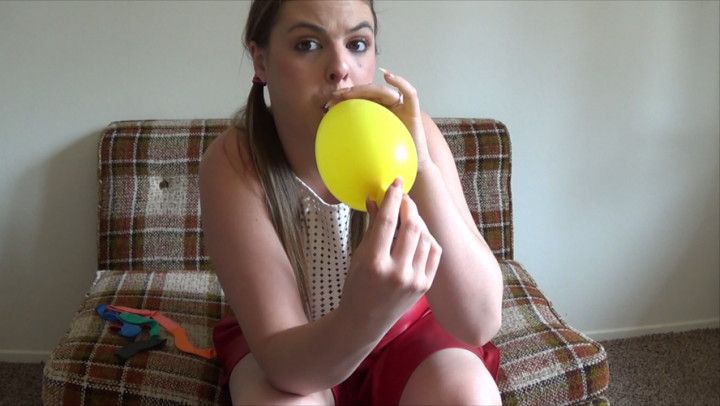 Kendra blows up her Balloons