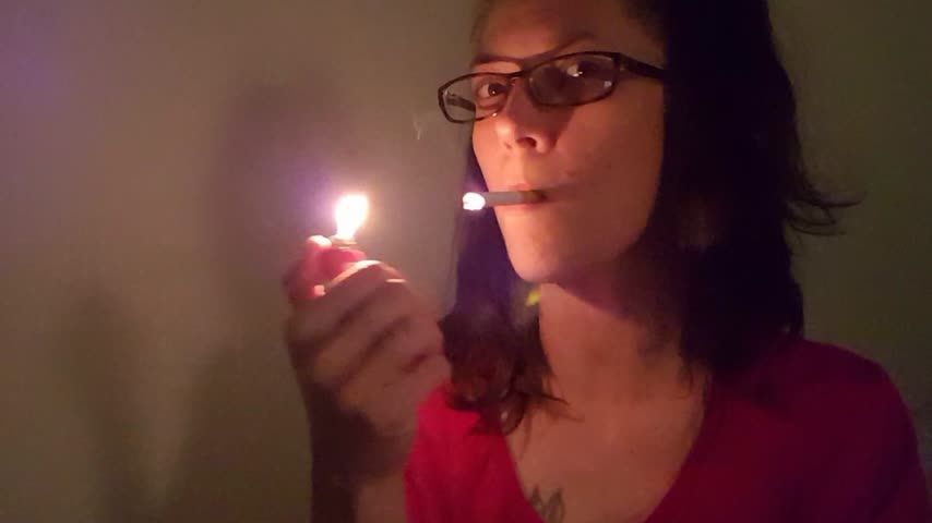 smoking in pigtails and glasses