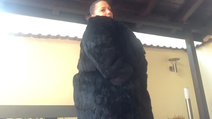 fur coat on naked body
