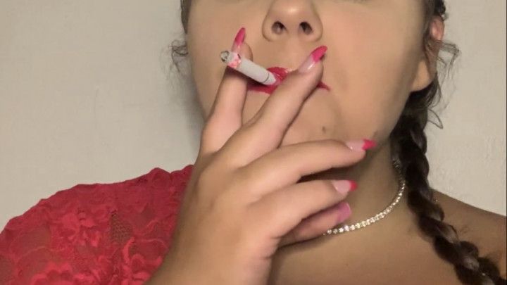 Smoking a cigarette with red lipstick