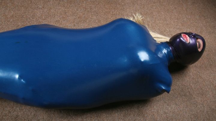 Latex Model in her blue latex sleepsack