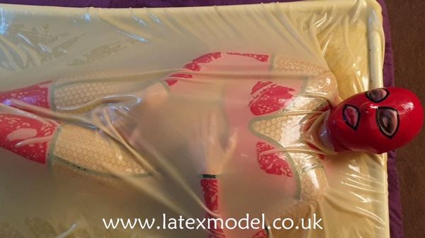 Latex Model squirming in a latex vacbed