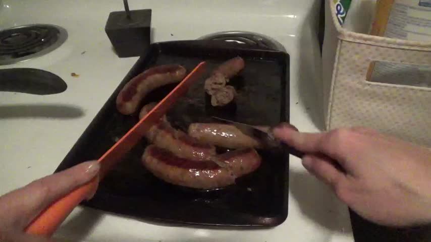 Two beautiful Goddesses cut up sausage