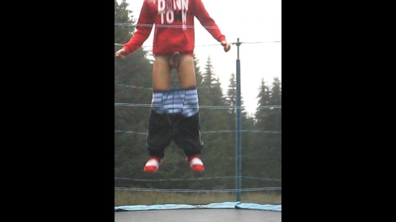Twink shows his big cock for fun on a trampoline at the camp