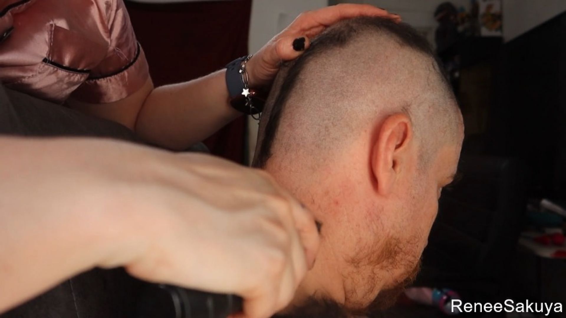 Shaving his head from multiple angles upclose
