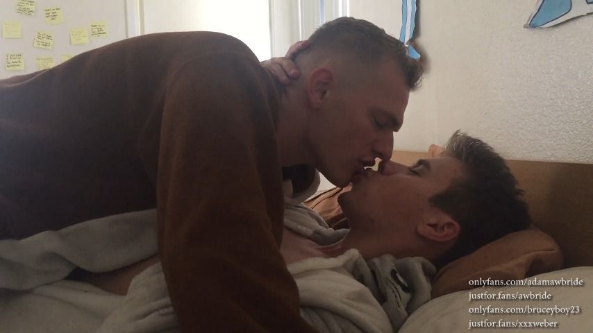Boyfriends kiss in onesies