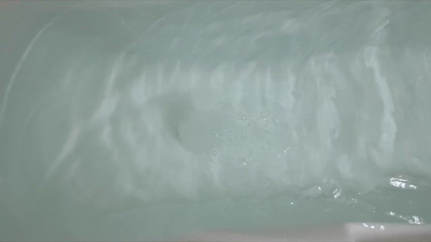 Slow motion bath with clothes on