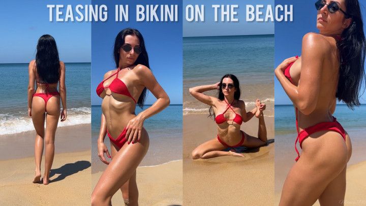 Teasing in red bikini on the beach