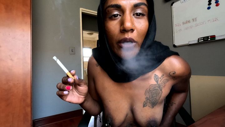 Smoking a cigarette while wearing a hijab and nipple clamps