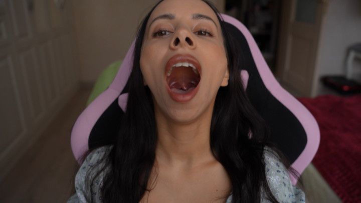 I show my hot uvula and long tongue sitting on gaming chair