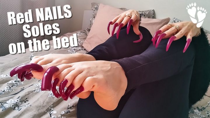 Red NAILS &amp; Soles on the bed