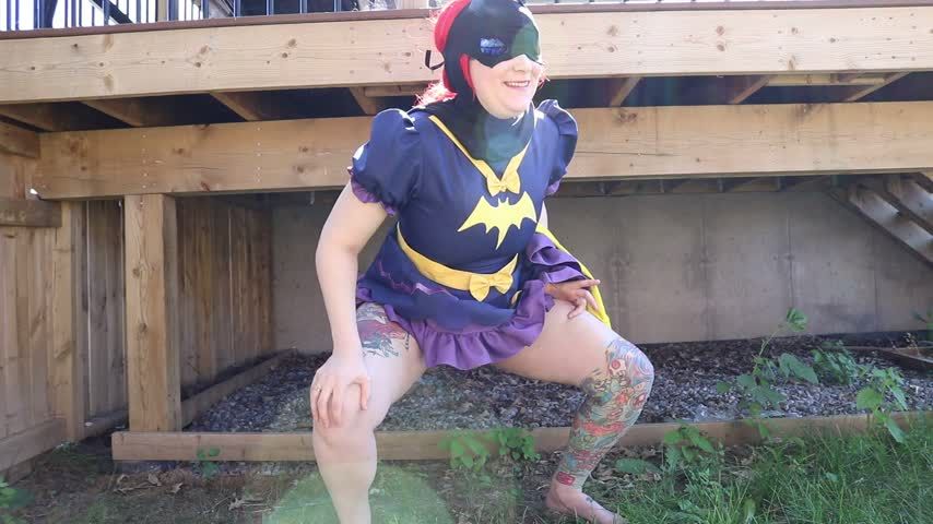 Batgirl takes outdoor pee