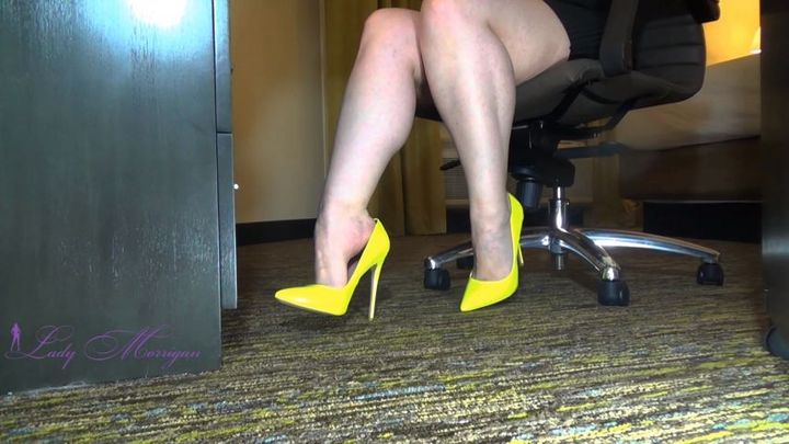 Feet And High Heels At The Desk