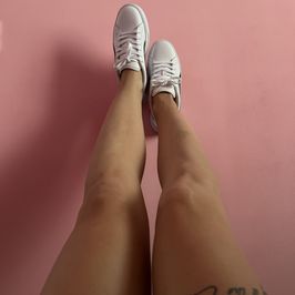 Worn White Puma Sneakers