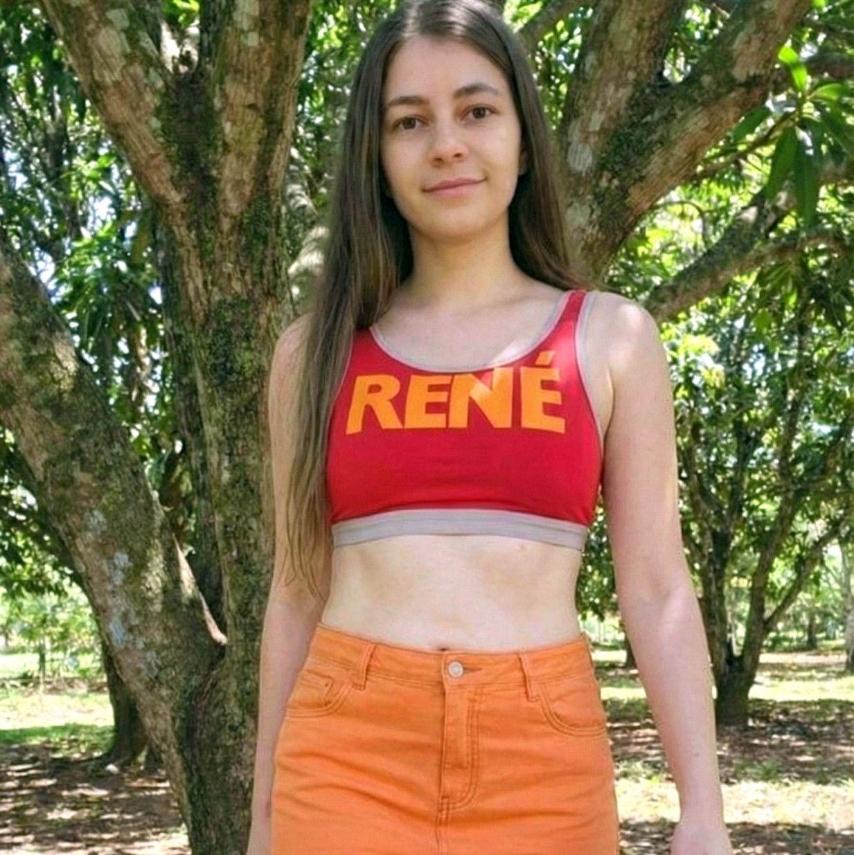 10 SFW photos wearing a denim skirt and a red top