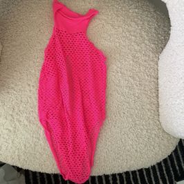 Hot pink fishnet body suit