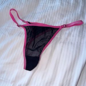 Black mesh panties with raspberrycolored trim