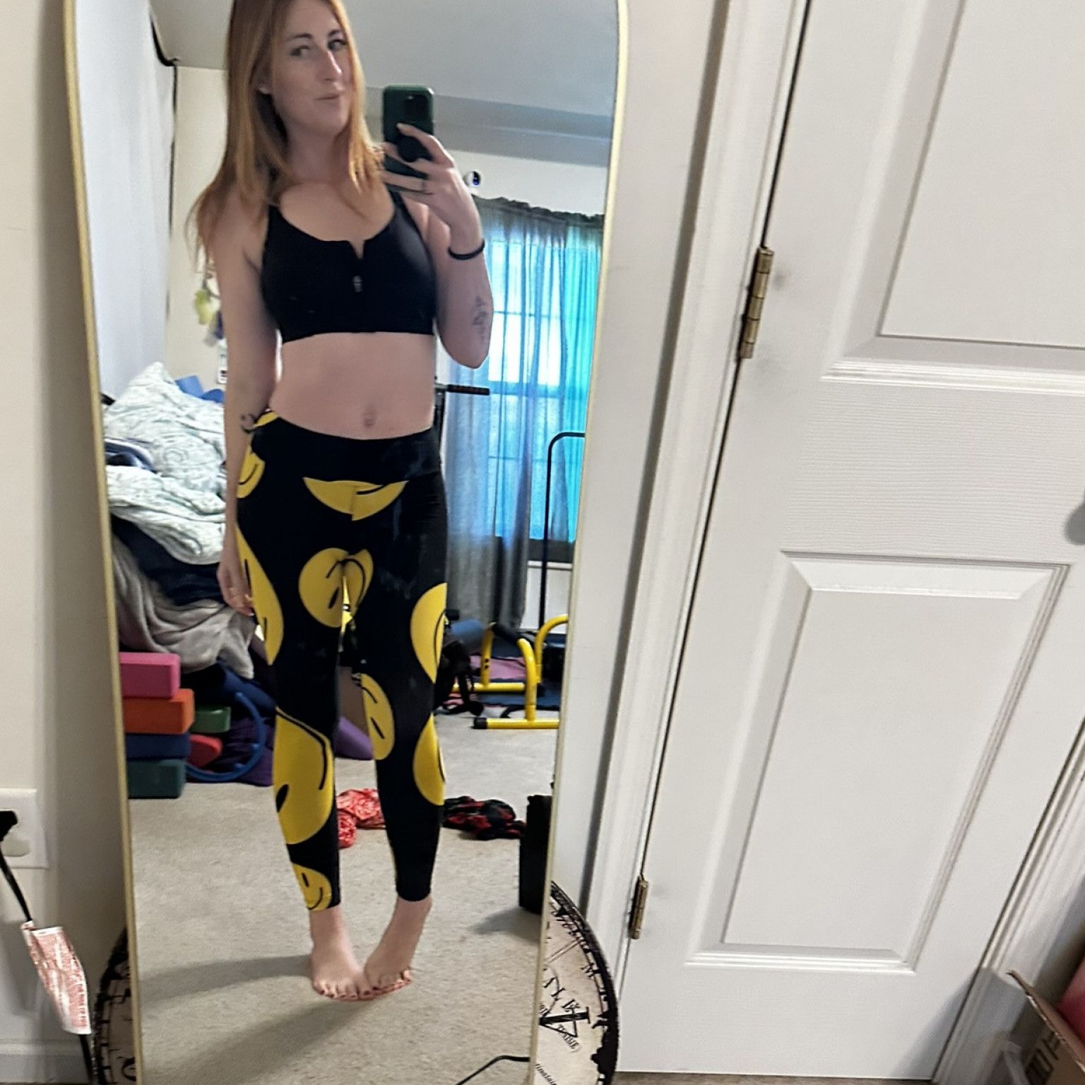 Smiley yoga pants worn