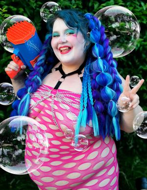 Cute BBW clown playing with bubbles and balloons