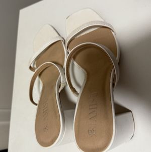 My used white heels