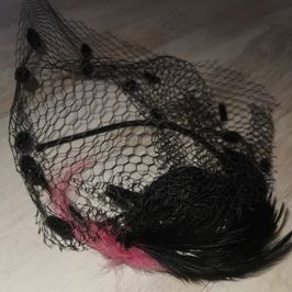 Pink and black feathered rich widow alice band with netting