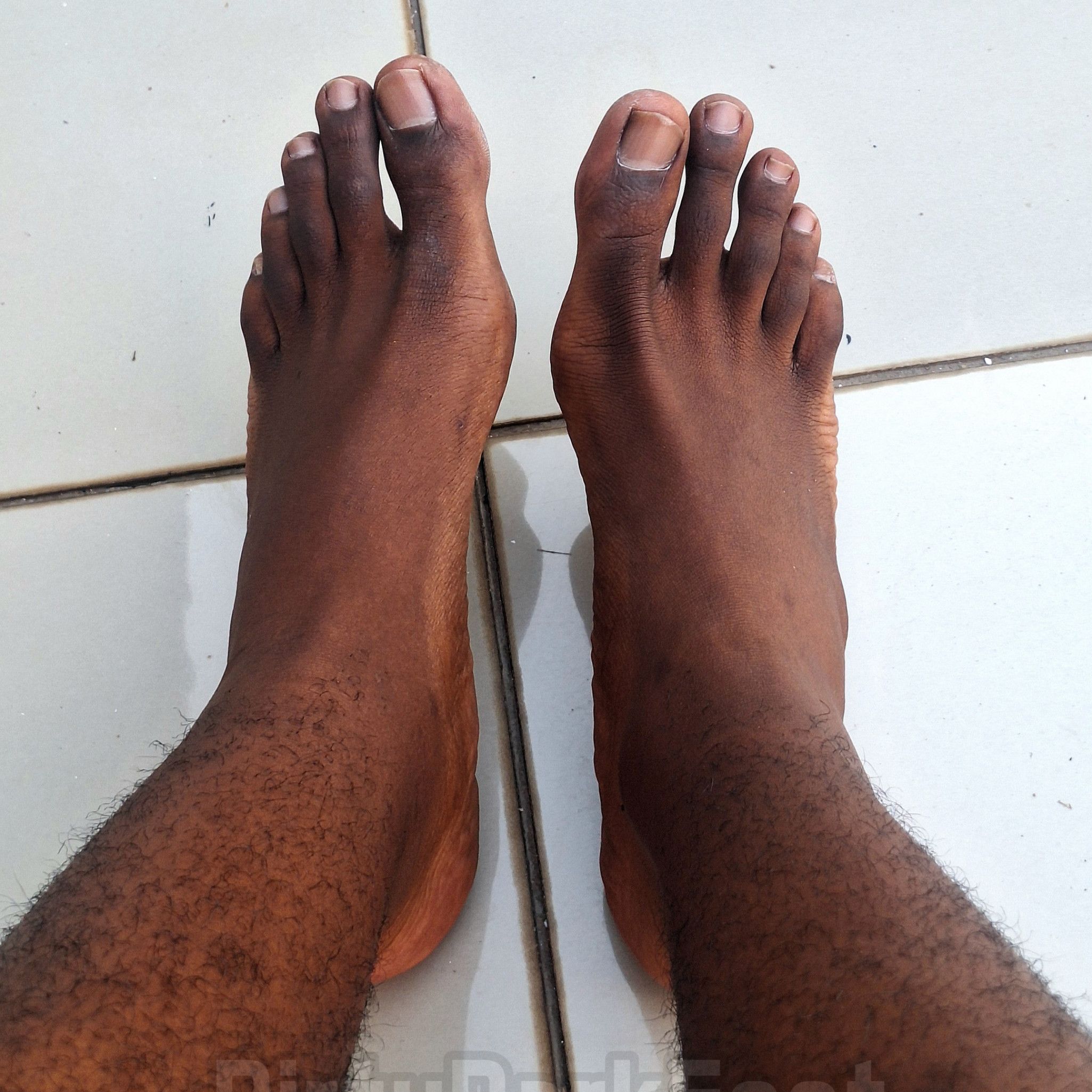 37 Dark Dirty Feet on light tiles photos